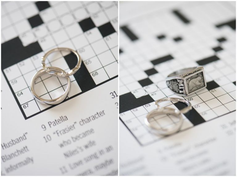 Wedding rings on top of crossword puzzle created by the bride and groom for their wedding at The Oaks Waterfront Inn in St. Michaels, MD by Melissa Grimes-Guy